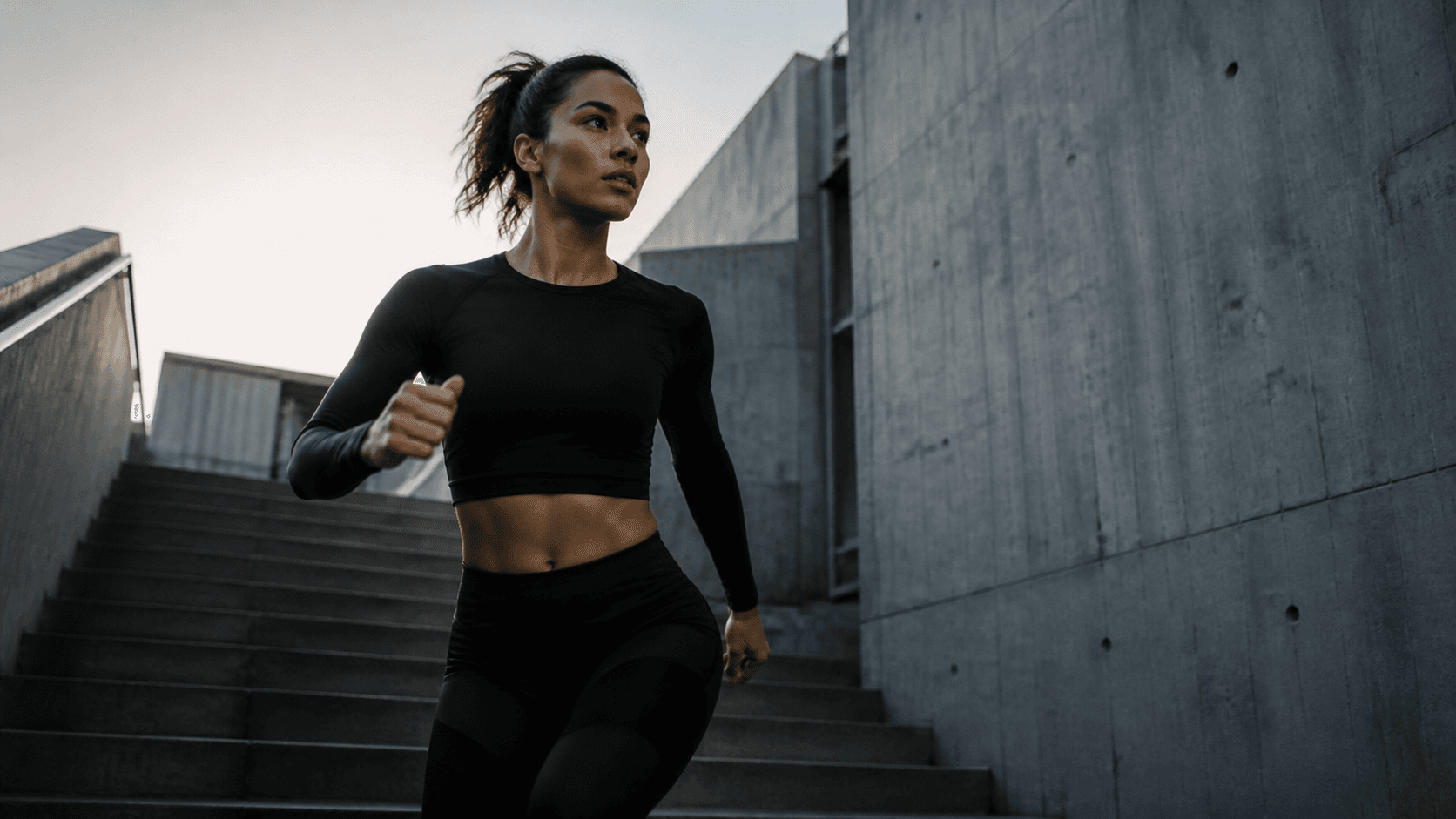 Athlete moving through a concrete city setting